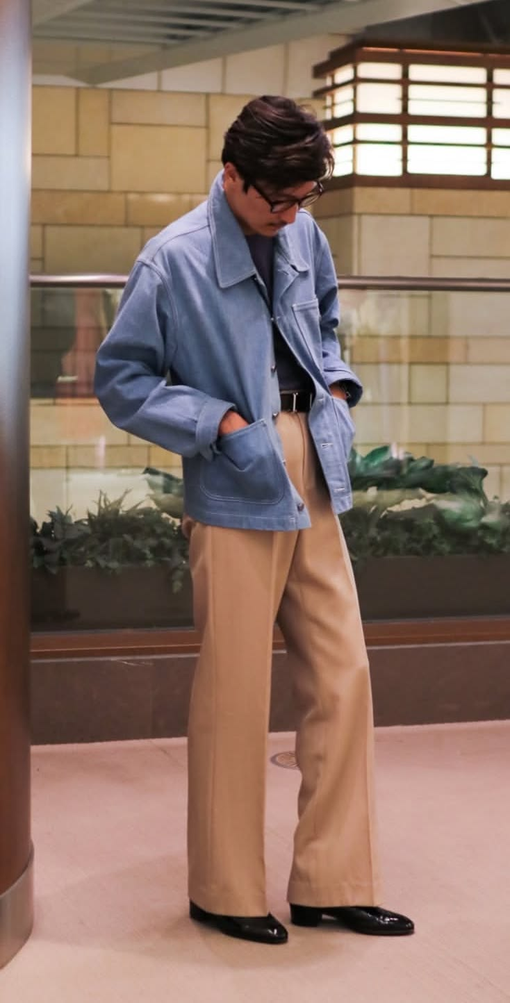 Men's resort elegant look with a pale blue jacket and tan trousers